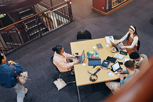 teens studying in library